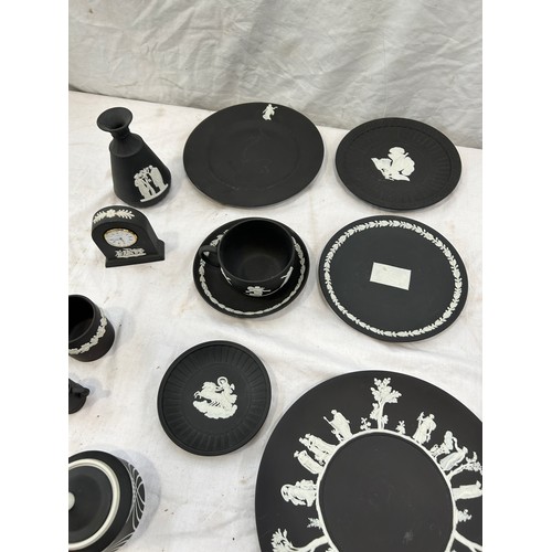 242 - Selection of black and white Wedgwood Jasper ware to include plates, clock, cups etc