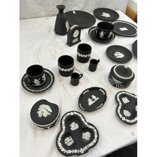 242 - Selection of black and white Wedgwood Jasper ware to include plates, clock, cups etc