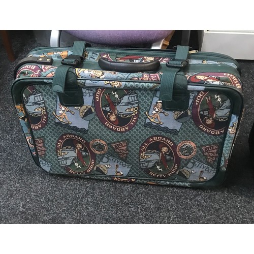 281 - Set of three quality/canvas suitcases and a betty boop suit case