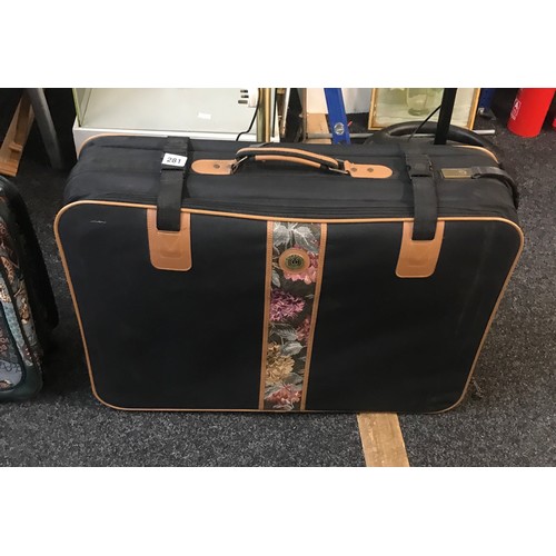 281 - Set of three quality/canvas suitcases and a betty boop suit case