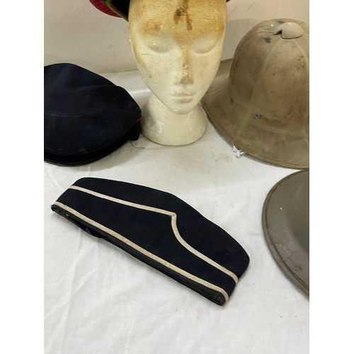 265 - 1942 pith helmet, military police hat, tin helmet and BB hat