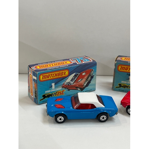 238 - Two boxed Matchbox Superfast dodge challenger number 1, 1975 blue and red
