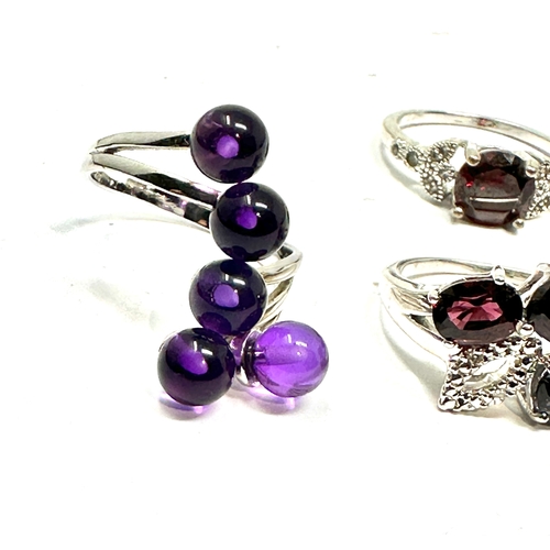 207 - 4 silver gemstone set rings