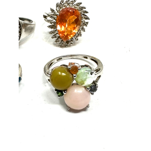 209 - 4 silver gemstone set rings