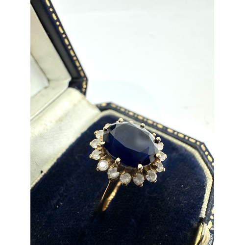 97 - 14ct gold tanzanite & white gemstone ring weight 3.8g