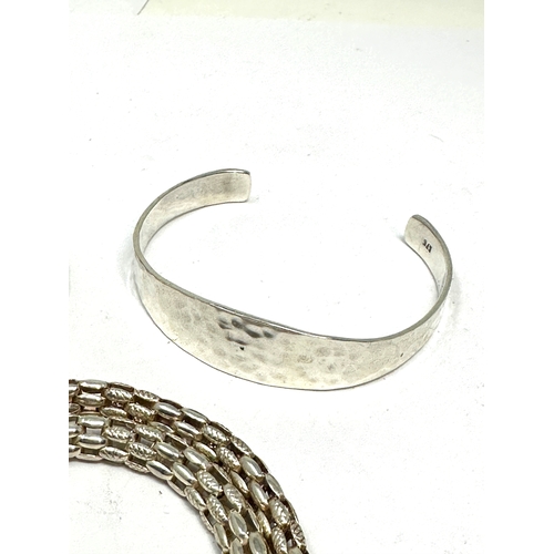 219 - 3 vintage silver items of jewellery inc 2 bangles 7 necklace weight 60g bangle missing stone