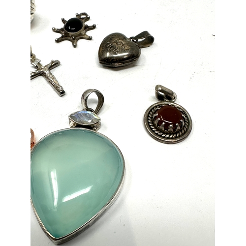 221 - selection of silver pendants weight 43g