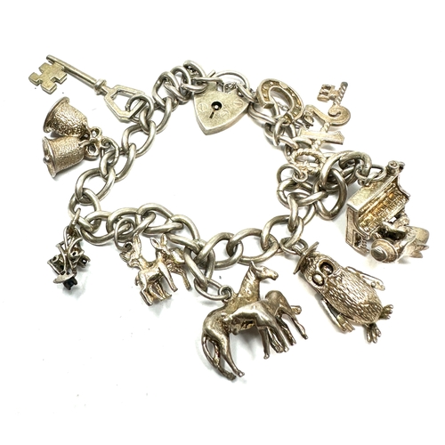 256 - Vintage silver charm bracelet and charms weight 36g