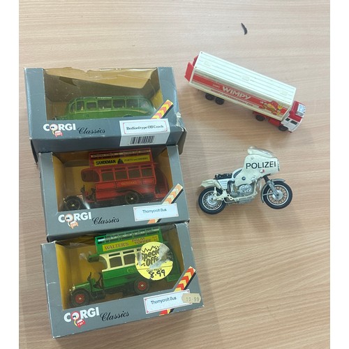 39 - Large size corgi buses and truck and motorbikes some are in original boxes