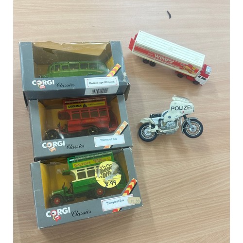 39 - Large size corgi buses and truck and motorbikes some are in original boxes