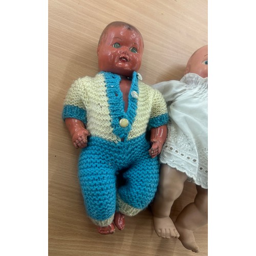 48 - Two antique clothed dolls