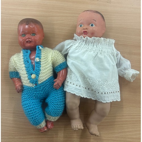 48 - Two antique clothed dolls