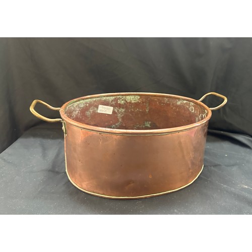 106 - Vintage copper cooking pot measures approx 5.5 inches tall by 12 long and 10 wide