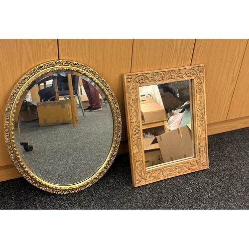 20 - Two mirrors one gilt the other carved wooden largest measures approx 23 inches tall