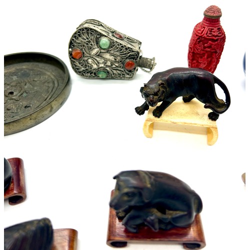 588 - Selection of oriental collectables to include animals, vases, stands