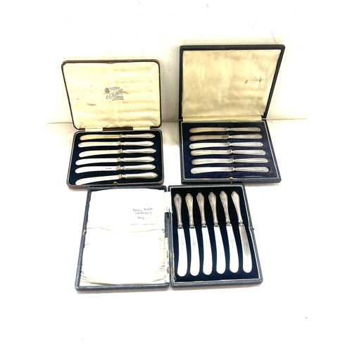 530 - Three cased sets of silver handles butter knives