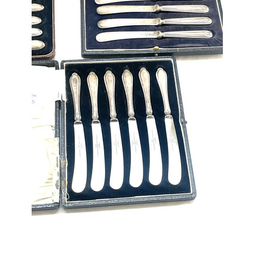 530 - Three cased sets of silver handles butter knives