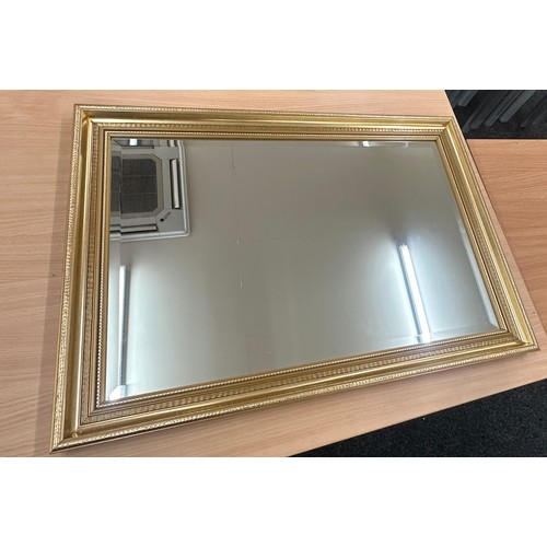 219 - Gilded bevel mirror, approximate measurements: 32 by 23 inches