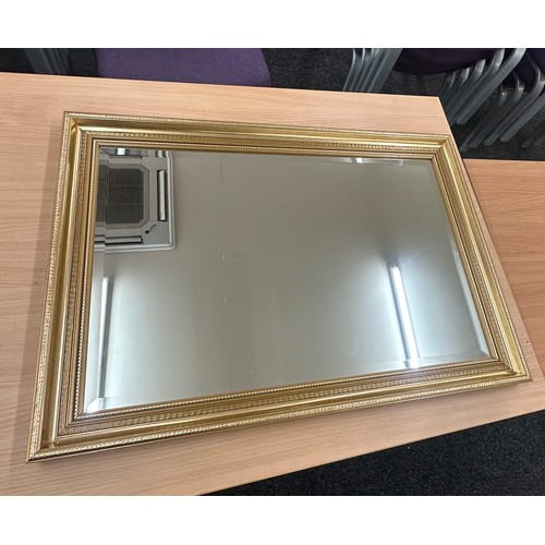 219 - Gilded bevel mirror, approximate measurements: 32 by 23 inches