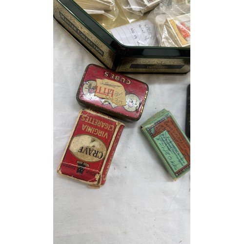 209 - Selection of cigarette card loose as well as an album of cards together with some vintage empty tins