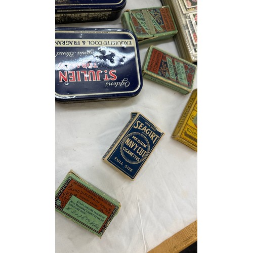 209 - Selection of cigarette card loose as well as an album of cards together with some vintage empty tins