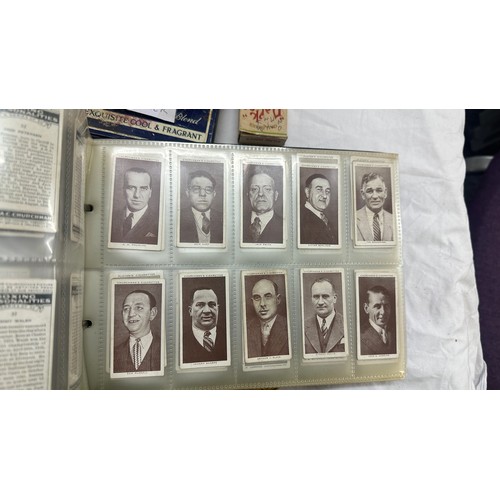 209 - Selection of cigarette card loose as well as an album of cards together with some vintage empty tins