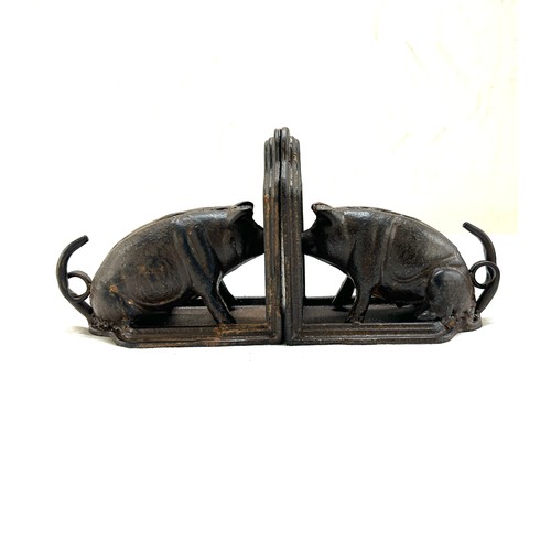 575 - Pair of cast iron pig book ends