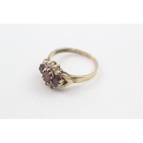 183 - 9ct gold garnet and cubic zirconia cluster dress ring (2.5g)