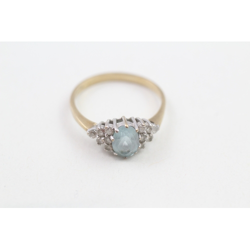 145 - 9ct gold white gemstone accented blue topaz set dress ring (1.9g)