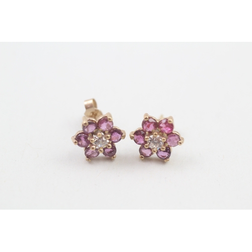 156 - 9ct gold ruby & cubic zirconia floral cluster stud earrings (1.2g)