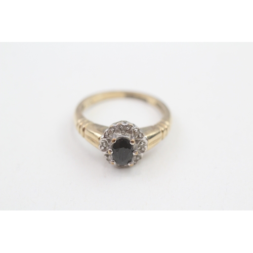 172 - 9ct gold black gemstone & diamond cluster ring (3.1g)