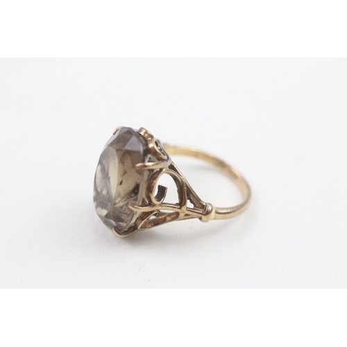 180 - 9ct gold smokey quartz dress ring (5.6g)