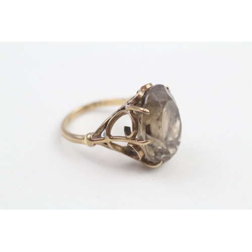 180 - 9ct gold smokey quartz dress ring (5.6g)