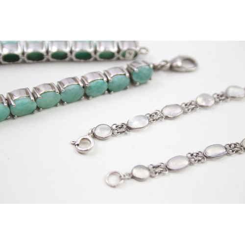 285 - A silver moonstone bracelet and an emerald tennis bracelet (33g)