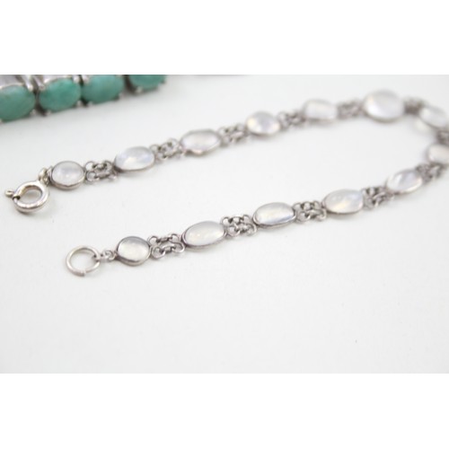 285 - A silver moonstone bracelet and an emerald tennis bracelet (33g)