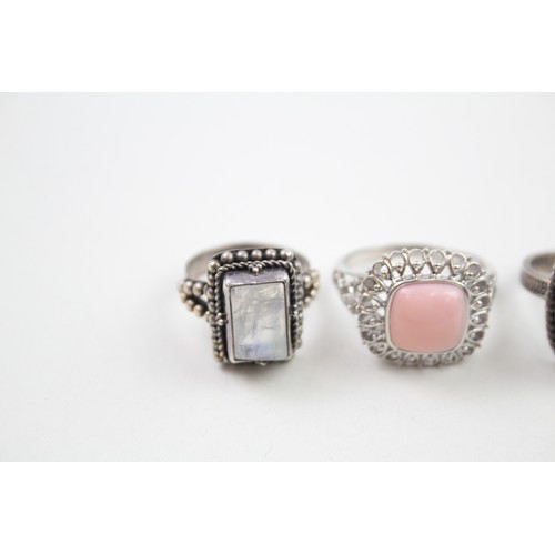 288 - Four silver stone set rings including moonstone (22g)