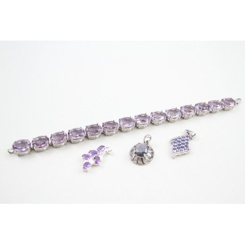 289 - A collection of stone set silver jewellery including an amethyst tennis bracelet (39g)