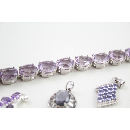 289 - A collection of stone set silver jewellery including an amethyst tennis bracelet (39g)