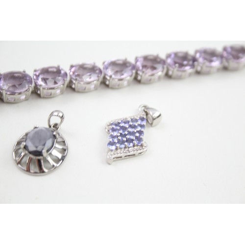 289 - A collection of stone set silver jewellery including an amethyst tennis bracelet (39g)