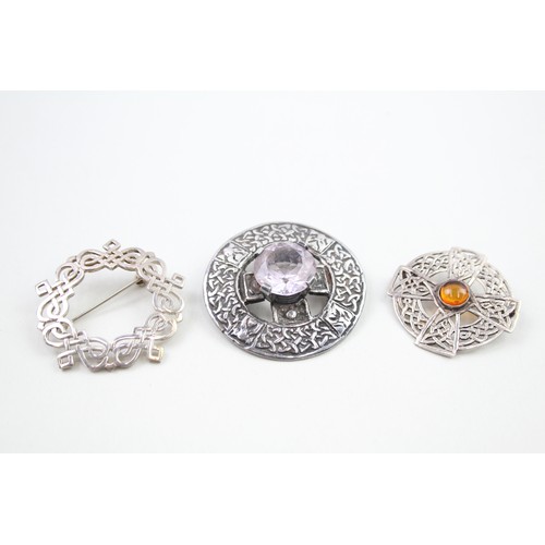 298 - Three Scottish silver brooches (37g)