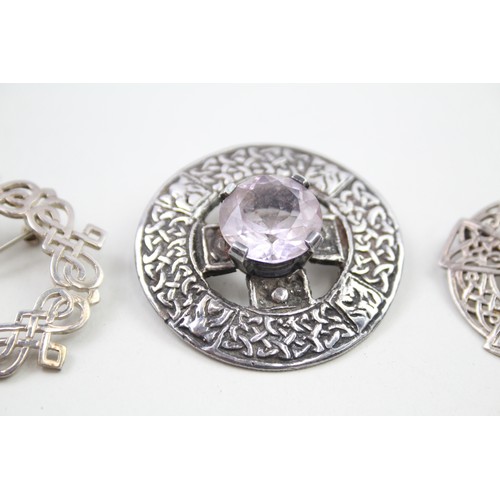 298 - Three Scottish silver brooches (37g)