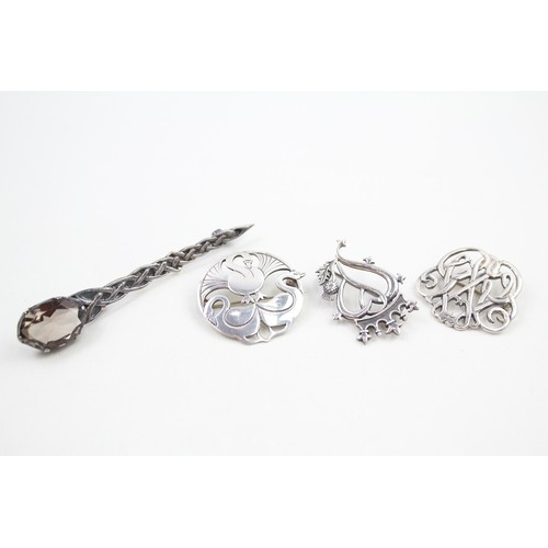 299 - Four Scottish silver brooches including Shetland silver (25g)