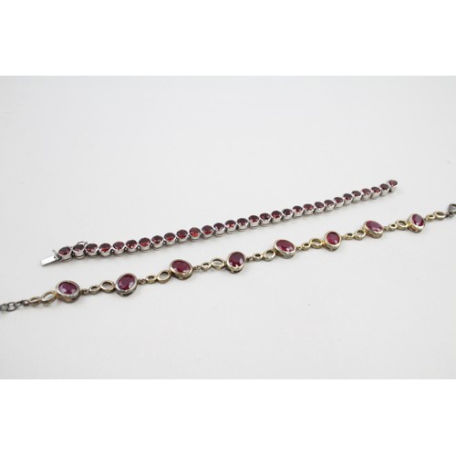 300 - Two silver stone set tennis bracelets including ruby and garnet (37g)