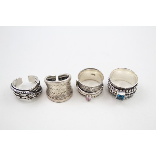 307 - Four silver statement rings (29g)