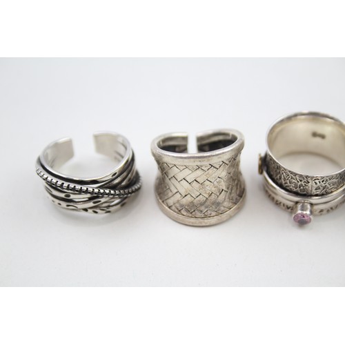 307 - Four silver statement rings (29g)