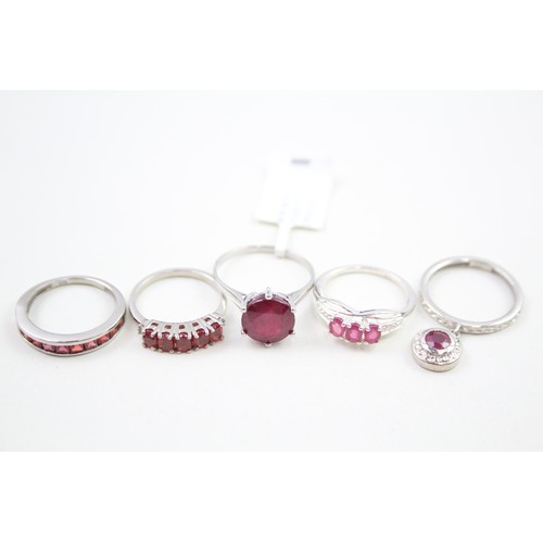 308 - A collection of silver garnet and ruby rings (13g)