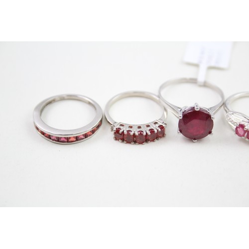 308 - A collection of silver garnet and ruby rings (13g)