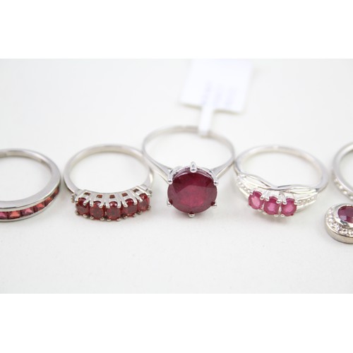 308 - A collection of silver garnet and ruby rings (13g)