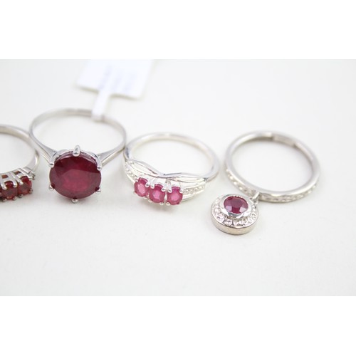 308 - A collection of silver garnet and ruby rings (13g)