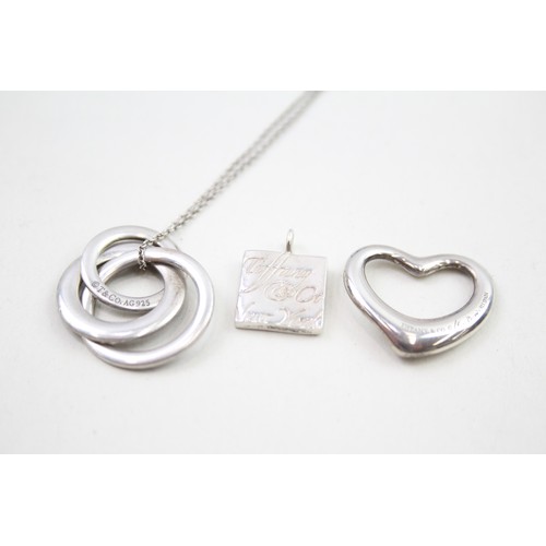 318 - A silver necklace and two pendants by Tiffany and Co (16g)